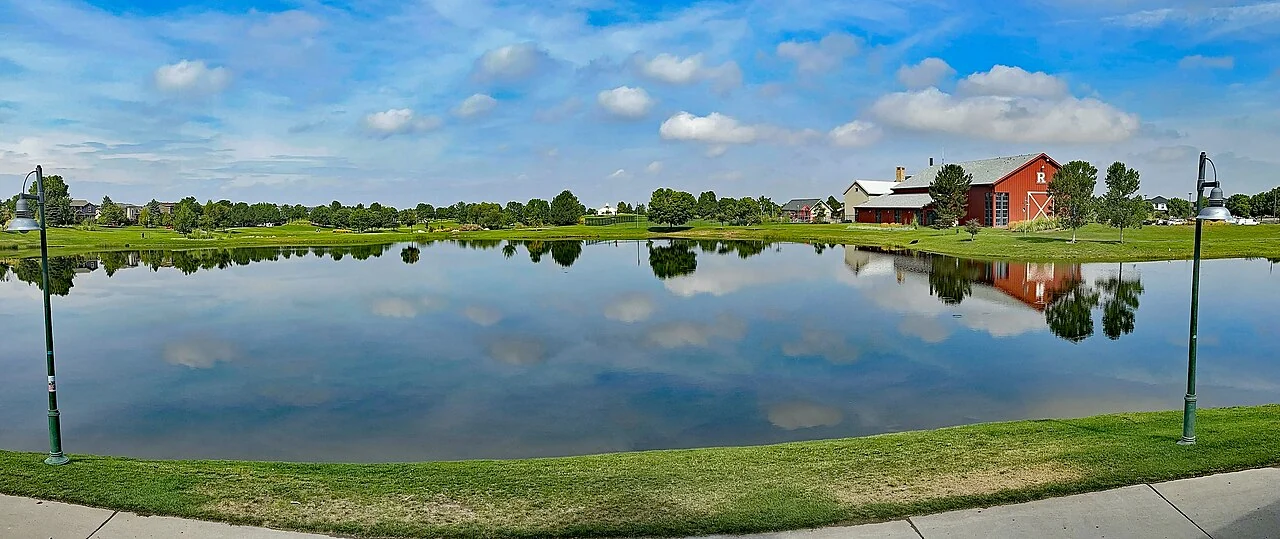 Reunion lagoon reflecting a blue summer sky in Commerce City
