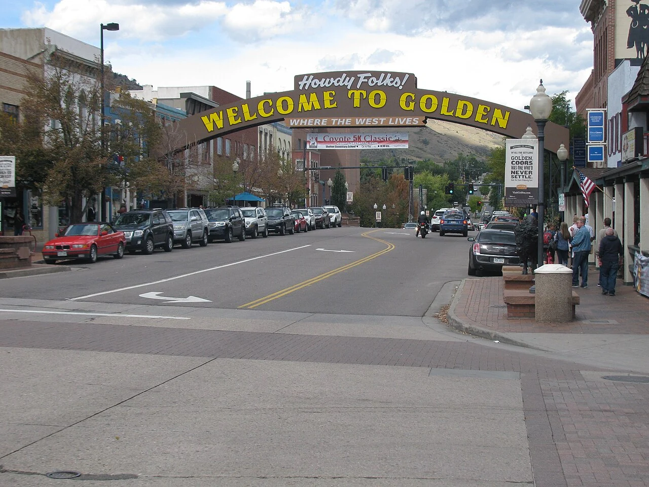 Golden welcome arch spanning Washington Street in historic downtown