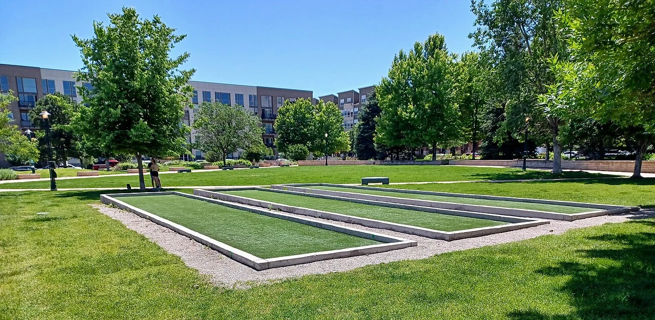 Green lawns and paths at Belmar Square in Lakewood