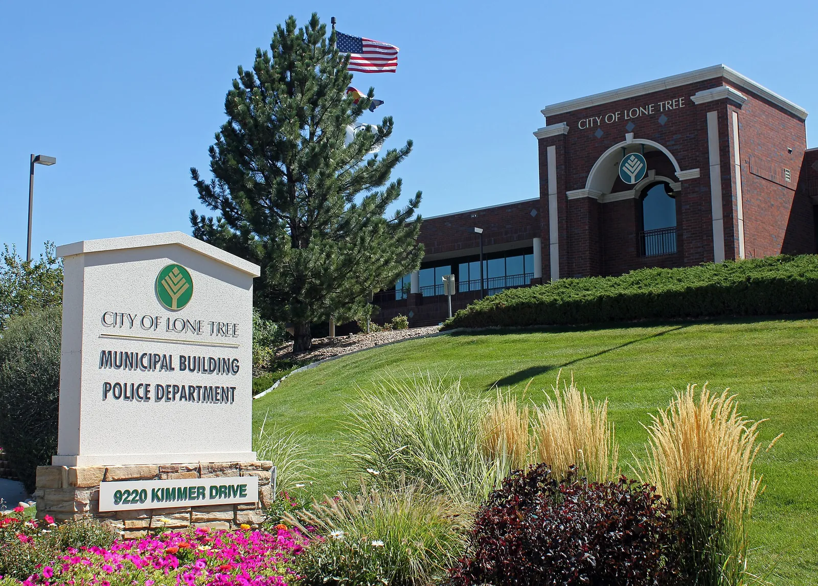 Lone Tree Municipal Building with landscaping and its city sign in Colorado